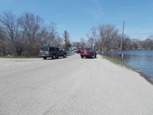 Cars made their way slowly through the water on Tower Rd.