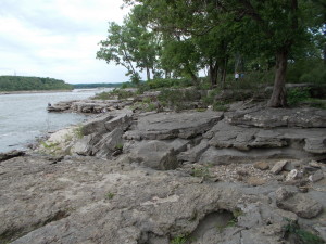 Walking along the river's edge on the fossil bed.