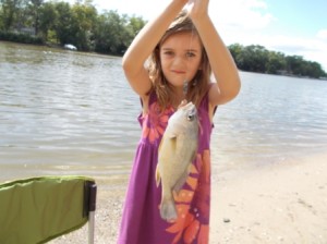 Bel showing off the fish she caught.