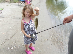 Sophia with her catch of the day.  This was the first fish.