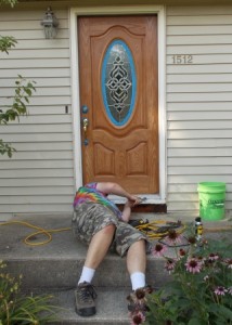 Rich doing repairs under the front door.