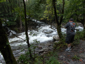 Rich getting a picture of the water from Ramsey Cascades into the Little Pigeon River.