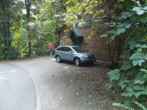 Our car sitting in front of Grandma's Gift cabin.  We are right on one of the curves.