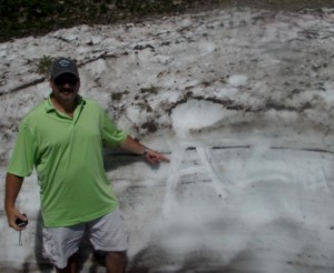 Alex leaves his mark in the snow. Just his initials this time.