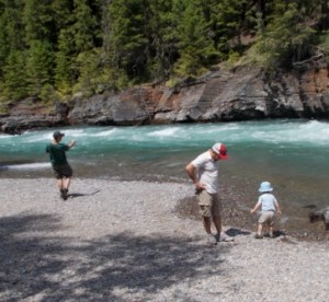 Boys skipping rocks.