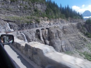 Bridge cut into the rock face.