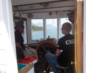 Captain Tom and Jeremy in the boat house