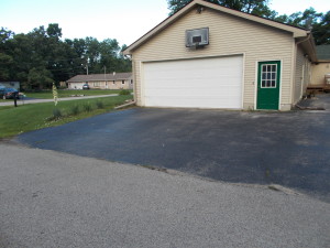 Old driveway in front of the main garage.
