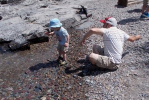Owen having fun throwing rocks.
