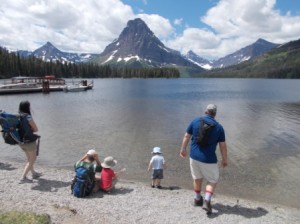 The boys skipping rocks at Two Medicine Lake before we take off for a hike.