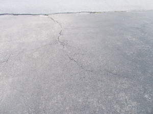 Some big cracks spidering over the surface.