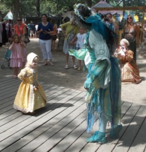 Young faire-goer dancing with the blue green fairy.