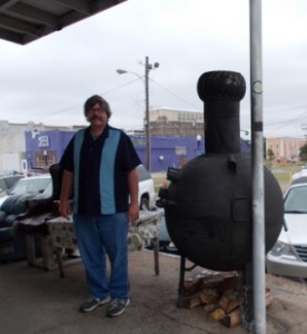 Rich with the pig smoker on the porch of Ground Zero.