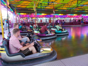 Teens waiting to kill others in bumper cars.