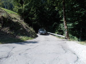 Car heading up the mountain road to get to the meadows.