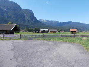 Village pasture is at the end of our street. We can see it over the houses in front of us.